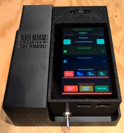 V3 touchscreen unit in its caddy showing the interface